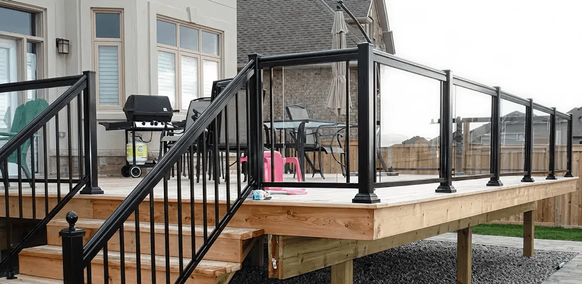 Handrail installation on a deck staircase for safety and code compliance in Houston, TX